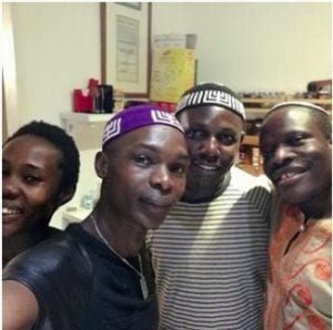 A group of black Jews wearing large kippot.