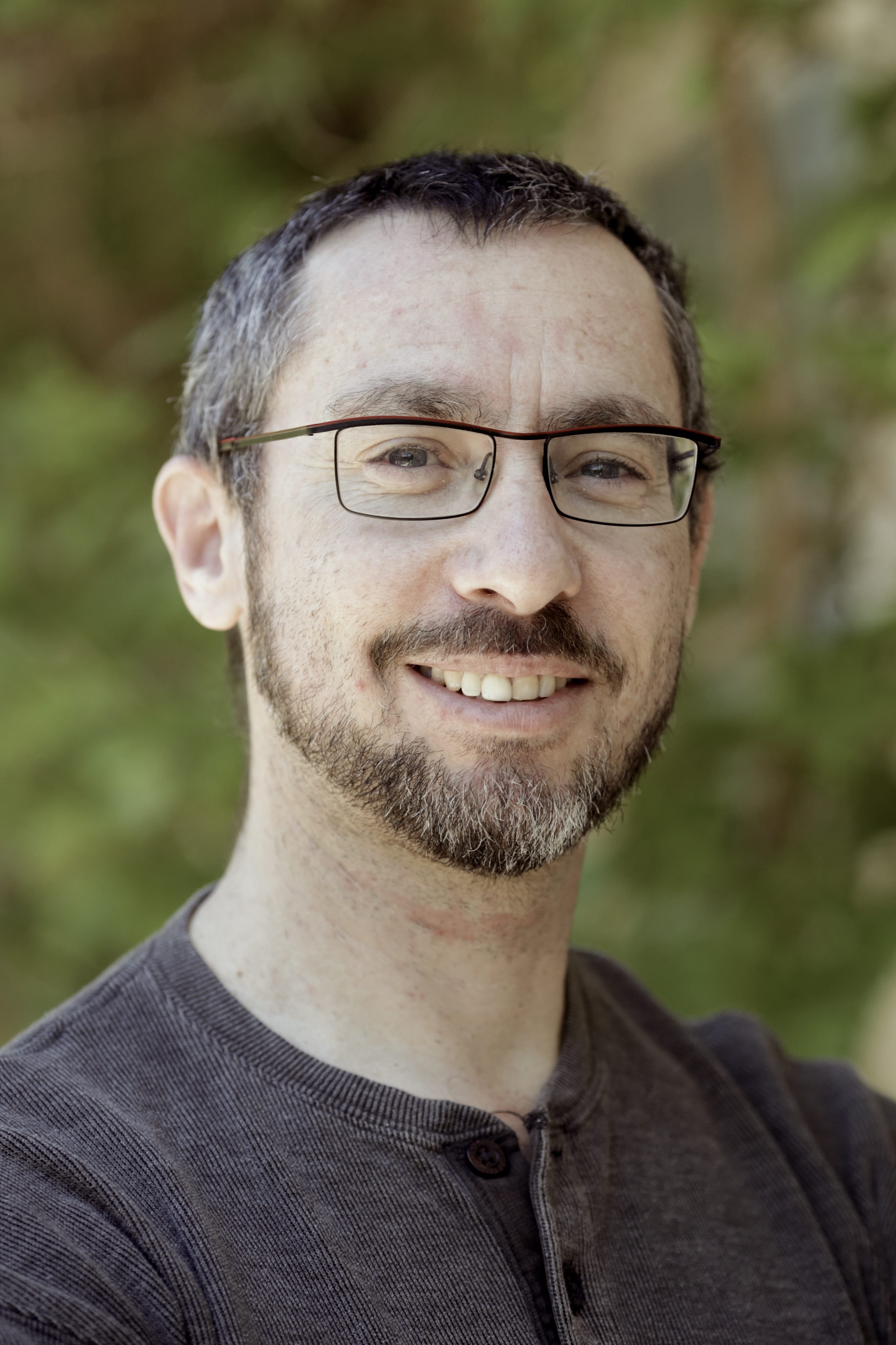 Men with glasses, black shirt