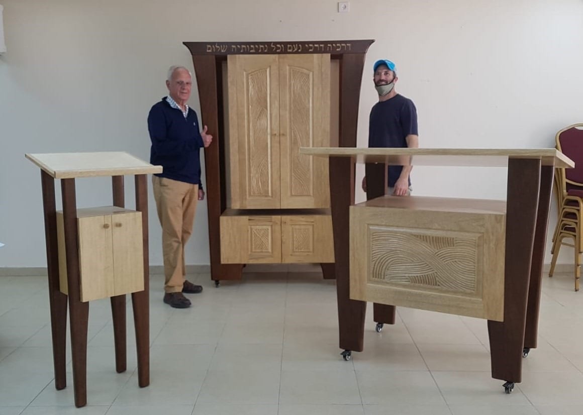 Torah ark, table, lecturn, two men